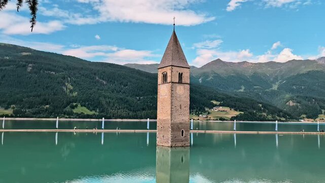 Sunken Bell Tower of Alt Graun in Lake Reschen South Tyrol Italy 4K