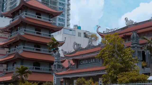 Traditional Asian style Vinh Nghiem Pagoda with its gorgeous bended tiled roofs and sculptures chofahs on the edges. Saigon Ho Chi Minh, Vietnam. Traditional Asian style Vinh Nghiem Pagoda