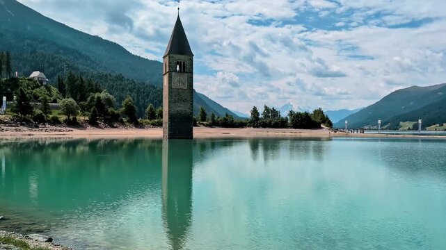 Sunken Bell Tower of Alt Graun in Lake Reschen South Tyrol Italy 4K