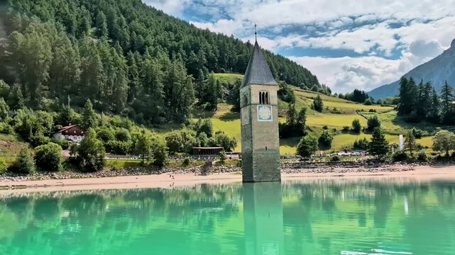 Sunken Bell Tower of Alt Graun in Lake Reschen South Tyrol Italy 4K