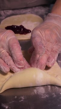 Delicious pies with berry jam. Vertical video about homemade pastries, cooking and confectionery