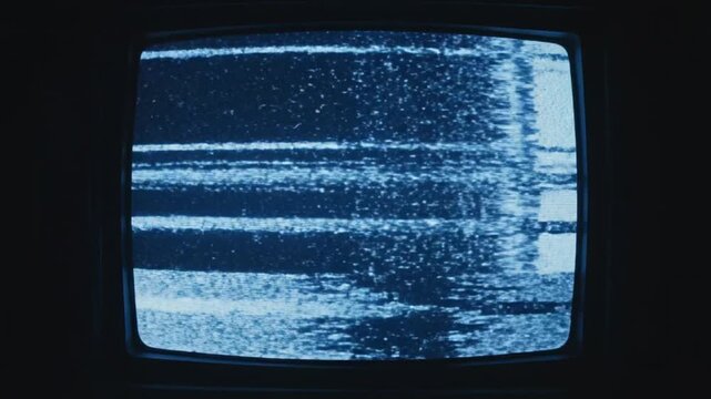 Close up view. CRT scanline texture. Static noise and interference on vintage television. Analog signal.