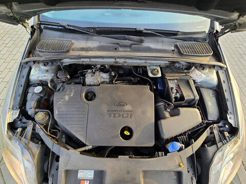 Overhead view of the engine bay of a silver Ford Mondeo Mk4 with 1.8 TDCi Duratorq diesel engine, parked in a residential area, Poland, Europe.