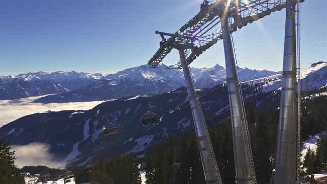 Chairlift in Zell am See Ski Resort on Sunny Day in Winter Alps Mountains