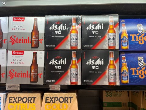 Asahi Super Dry, Steinlager Tokyo Dry, and Tiger beer multi-packs on display at PAK'nSAVE supermarket in Otara-Papatoetoe - Auckland, New Zealand, February 8, 2023