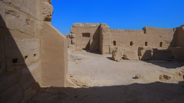 Ancient painted walls and ceiling with gods figures, hieroglyphics and cartouches inside Seti I temple, Luxor Egypt.