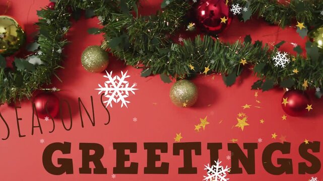 Animation of christmas greetings over christmas decorations