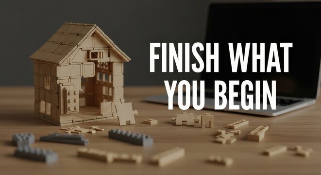 Unfinished Wooden Model House Building Project on Desk