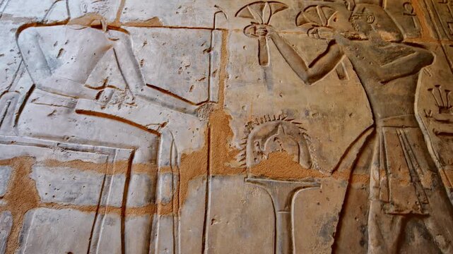 Close-up of detailed hieroglyphic rows with cartouches carved in stone lintel at Seti I temple Luxor Egypt.