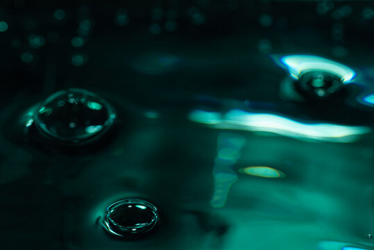 323.Three Bubbles on Glossy Teal-Green Liquid Surface