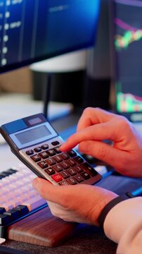 Financial calculator hands office desk trading analysis workspace business environment keyboard monitor charts budgeting accounting investment planning fintech data management productivity
