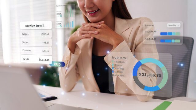 Businesswoman analyzing holographic financial data for business growth and budget management with futuristic technology digital invoice business analytics