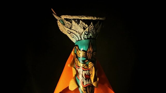 phi ta khon festival mask with dark background spinning loop 