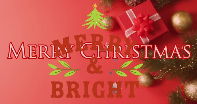 Animation of christmas greetings text over christmas presents and decorations