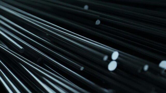 Abstract metallic cylindrical rods forming a complex arrangement, showcasing a dark, sleek, and high tech industrial aesthetic with a shallow depth of field