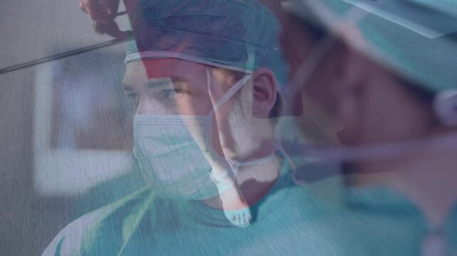 Animation of uk flag over doctors during surgery