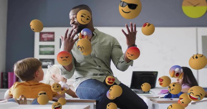 Animation of emoji icons over diverse schoolchildren and teacher