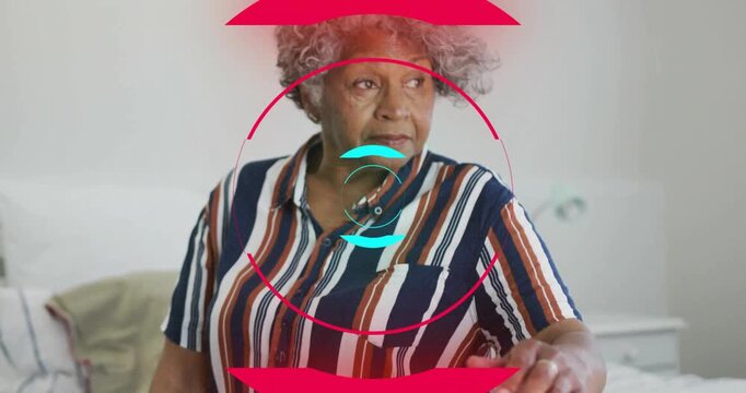 woman sitting on bed using health tech interface with red circle graphics and turquoise brackets