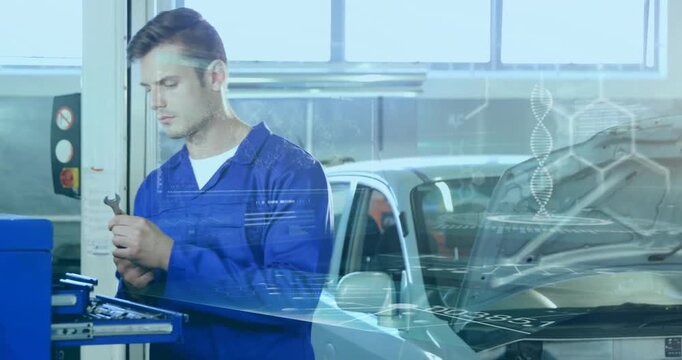 Mechanic inspecting part in auto workshop, overlay showing torque data, flashing warning icons