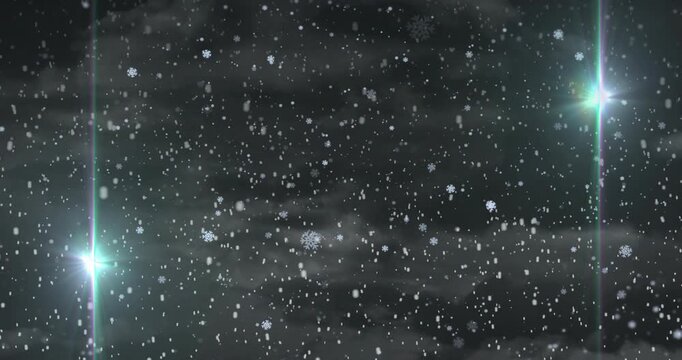 Cloudy night launching drifting snowflakes growing under pulsing green blue flares for winter scene