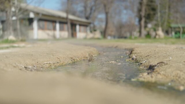 Steaming thermal mineral spring flowing through sacred Vanga temple grounds in Rupite Bulgaria