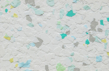 Fototapeta premium White pastel multicolor decorative flakes wall texture or pattern as background