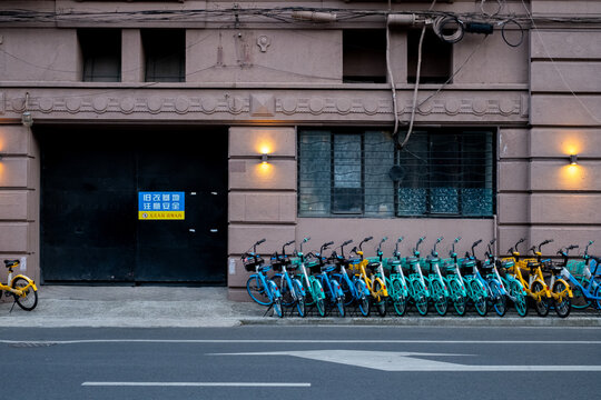 Shared bicycles parked in a traditional Shanghai lane, daily life in a Chinese alley, Shikumen architecture
