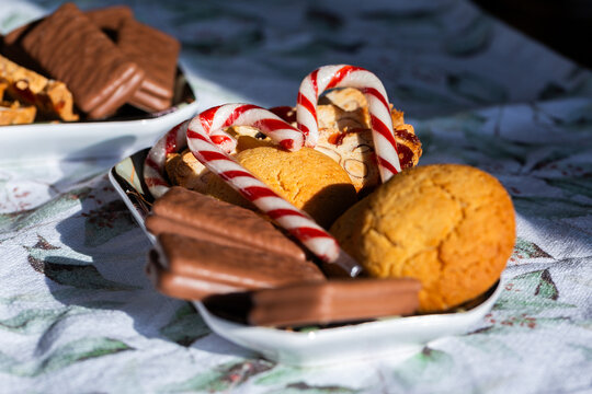 tray of candy canes and homemade ginger biscuits and Tim Tams on table at Christmas party