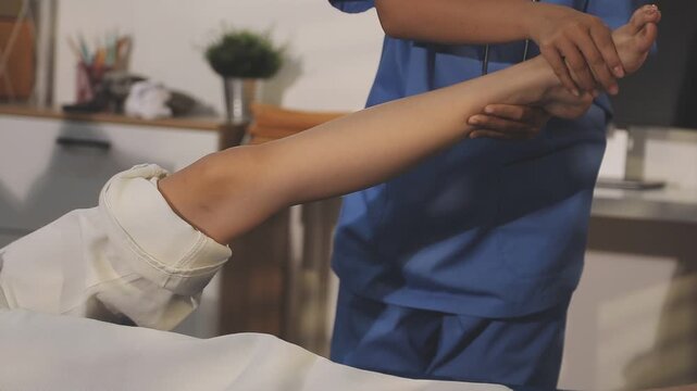 physiotherapist exam patient's knee. Senior patient with knee injury visit his physiotherapist