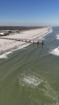 Aerial view of warm sunny day at St Augustine beach pier near Anastasia State Park in St Augustine, Florida. 