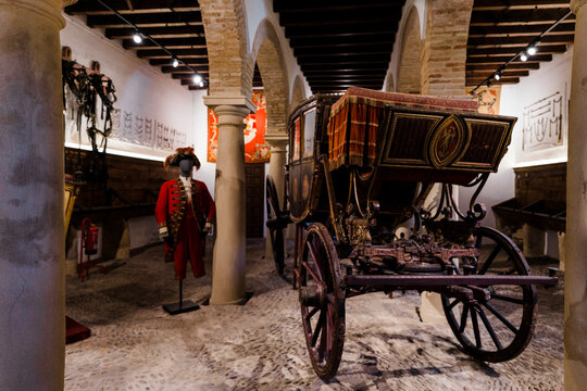 Old Spanish horse carriage and a suit in Cadiz, Spain. 