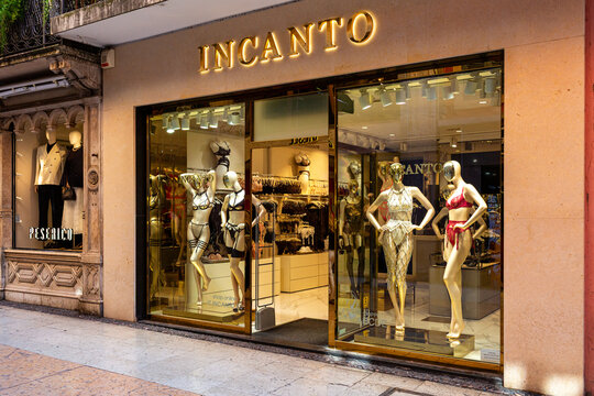 Verona, Italia - March 23, 2026: Incanto lingerie store display featuring mannequins in various styles of lingerie with illuminated signage and elegant storefront design