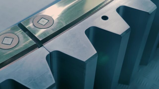 A large industrial spur gear made from individual segments allowing for a variety of sizes. Closeup. Shot in motion