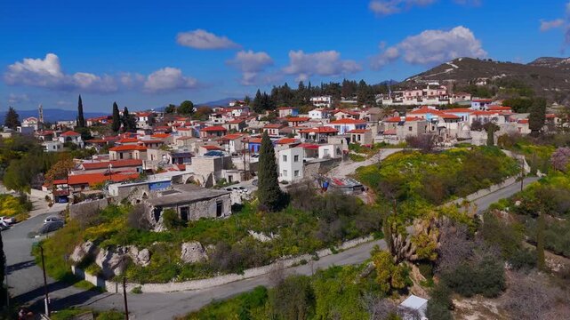 Aerial Low Flight Over Historic Kato Drys Village Stone Architecture and Steep Slopes