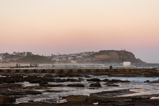Merewether Ocean Baths coastal landscape at dusk looking towards Nobbys Head