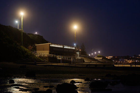 Merewether Ocean Baths building on coast at night