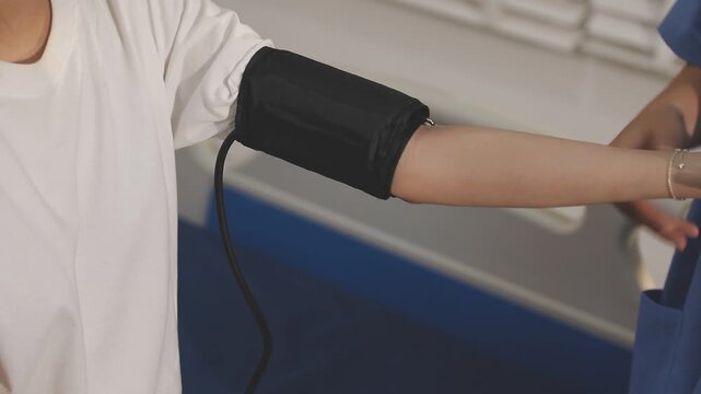 doctor and patient measuring blood pressure