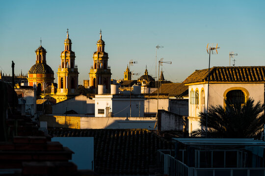 View of rooftop and the Cathedral of Seville at sunrise in Spain.