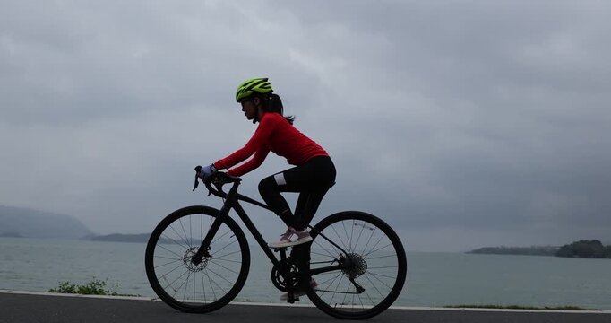 Riding bike on seaside road