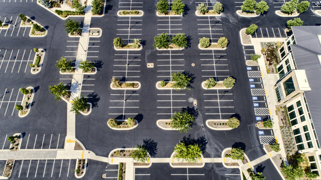 Overhead Aerial View of New Parking Lot with Landscaped Islands and Striped Spaces