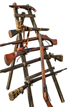 a variety of historical weaponry, primarily featuring various types of matchlock muskets
