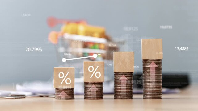Rising interest rates and inflation concept, wooden blocks with percent signs on coin stacks with upward white graph representing financial growth and investment return