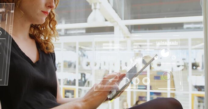 Tapping tablet, woman in black-top on ledge reading data, HUDs appearing in workspace, copy space