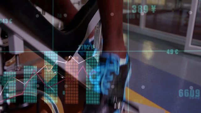 Session starting, rider's legs in shorts pushing pedals at gym, bike strap, blue-laced shoes