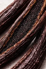 Vanilla pods macro close up with rich aromatic seeds and textured natural spice background  © Nadia