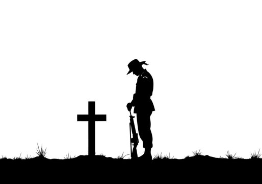 Silhouette of a Soldier Mourning at a Cross Grave for Remembrance Day and ANZAC Day Tributes