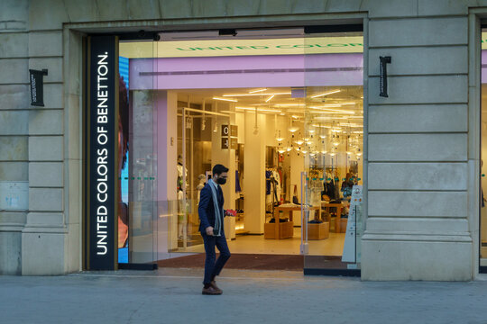 Barcelona, Spain - May 11, 2021. Logo and facade of Benetton, a fashion company founded in Ponzano Veneto, Italy