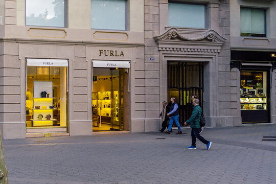 Barcelona, Spain - May 11, 2021. Logo and facade of Furla, an Italian luxury goods company created by the Furlanetto family in 1927