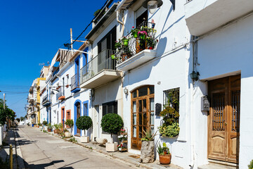 Fototapeta premium Mongat, Barcelona, Spain - Juny 13, 2021 Street with old fishing houses by the sea in Montgat, Barcelona