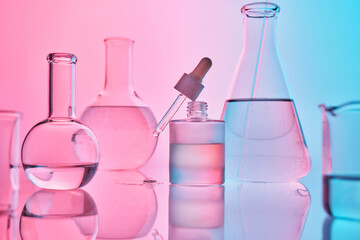 Science laboratory glassware experimenting with a dropper and liquid